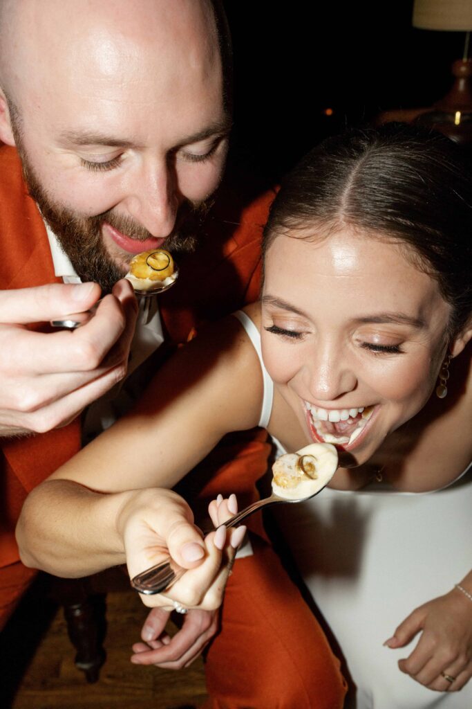 The bride and groom eating their rings in a banana foster.